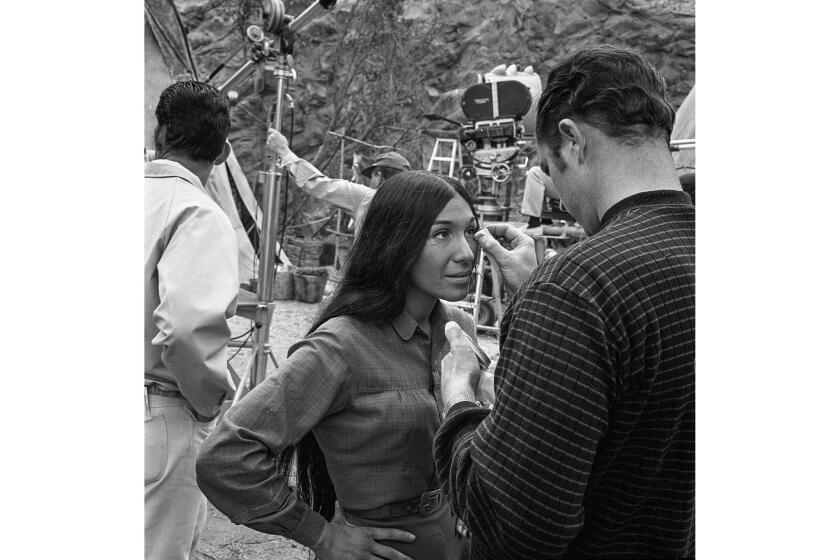 April 1968: Indian folk singer Buffy Sainte-Marie has make-up applied for an outdoor scene of TVâs âThe Virginianâ at Universal Studios. This photo appeared in the April 25, 1968, Los Angeles Times.