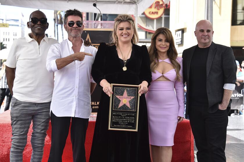Randy Jackson, Simon Cowell, Kelly Clarkson, Paula Abdul and Jason Halbert at the Hollywood Walk of Fame