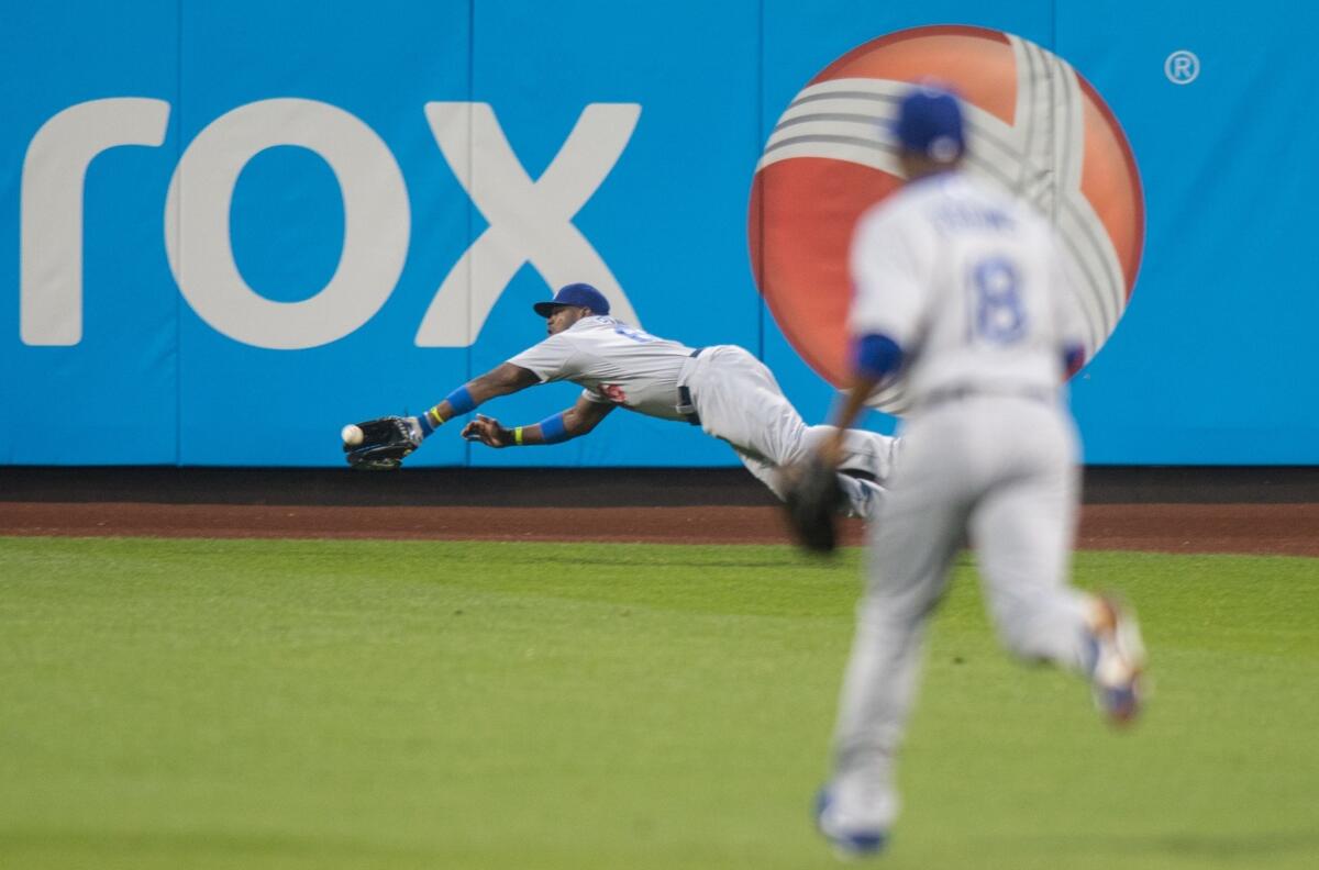 Yasiel Puig's diving catch in the second inning was the highlight of the night, but the right fielder's mistakes on the basepath didn't help the Dodgers in a 5-3 loss Thursday to the New York Mets.