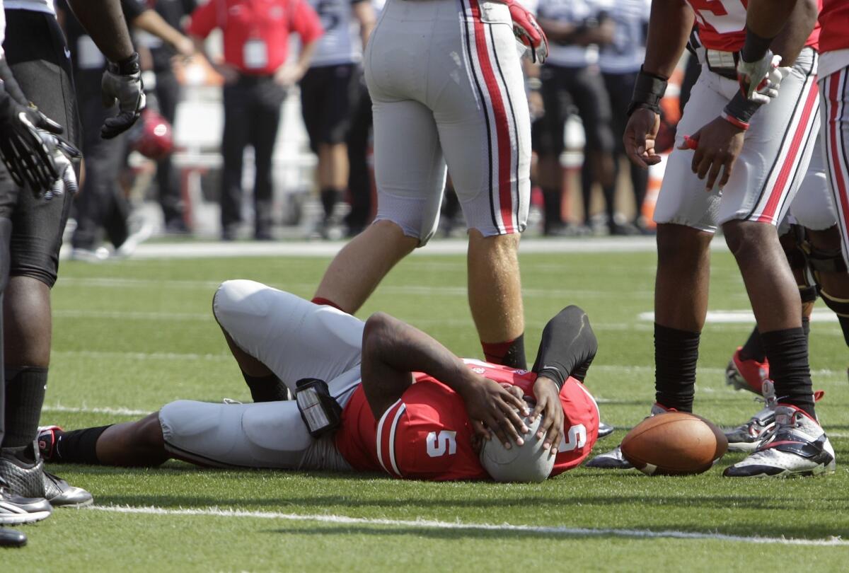 Ohio State quarterback Braxton Miller lies on the field after injuring his knee against San Diego State on Saturday.