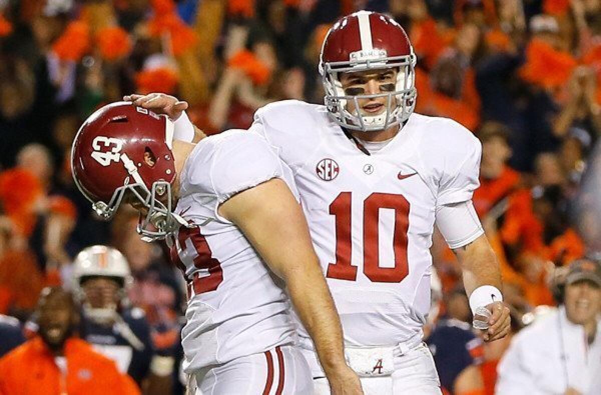 Alabama quarterback A.J. McCarron, consoling kicker Cade Foster after one of his three misses against Auburn, considers football "only a game." To hardcore SEC fans, though, an unbeaten team losing to a one-loss rival might not mean a rematch in the BCS title game.