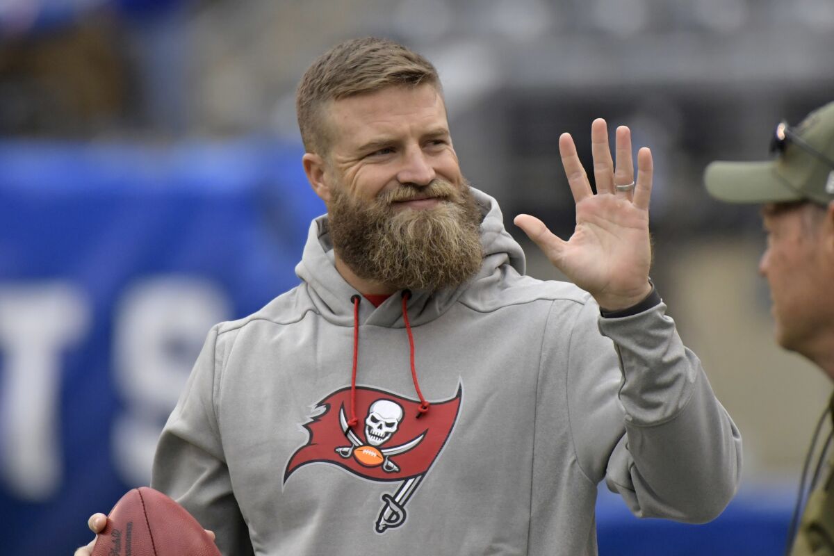 FILE - Tampa Bay Buccaneers quarterback Ryan Fitzpatrick waves to fans before an NFL football game against the New York Giants, Sunday, Nov. 18, 2018, in East Rutherford, N.J. Quarterback Ryan Fitzpatrick confirmed to The Associated Press on Friday, June 3, 2022, that he informed former teammates of his intention to retire a day earlier. Former Bills running back Fred Jackson first announced the news of Fitzpatrick’s retirement on his Twitter account by posting an image and message from his former Buffalo teammate. (AP Photo/Bill Kostroun, File)