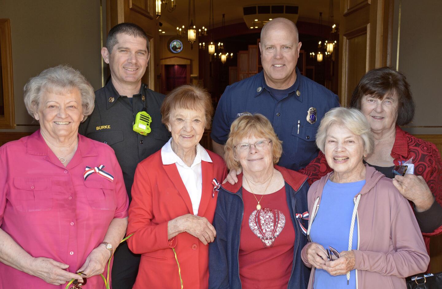Fire Marshall Dave Burke, second from left, and Captain Joel Petteys, were welcomed by members of the Golden Girls Cookie Brigade, Kaye Miljanich, from left, Doris Owings, Darlene Niers, Mary Dunn, and Jeanne Finn.