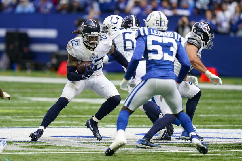Tennessee Titans running back Derrick Henry (22) cuts away from Indianapolis Colts outside linebacker Darius Leonard (53) in the first half of an NFL football game in Indianapolis, Sunday, Oct. 31, 2021. (AP Photo/Darron Cummings)