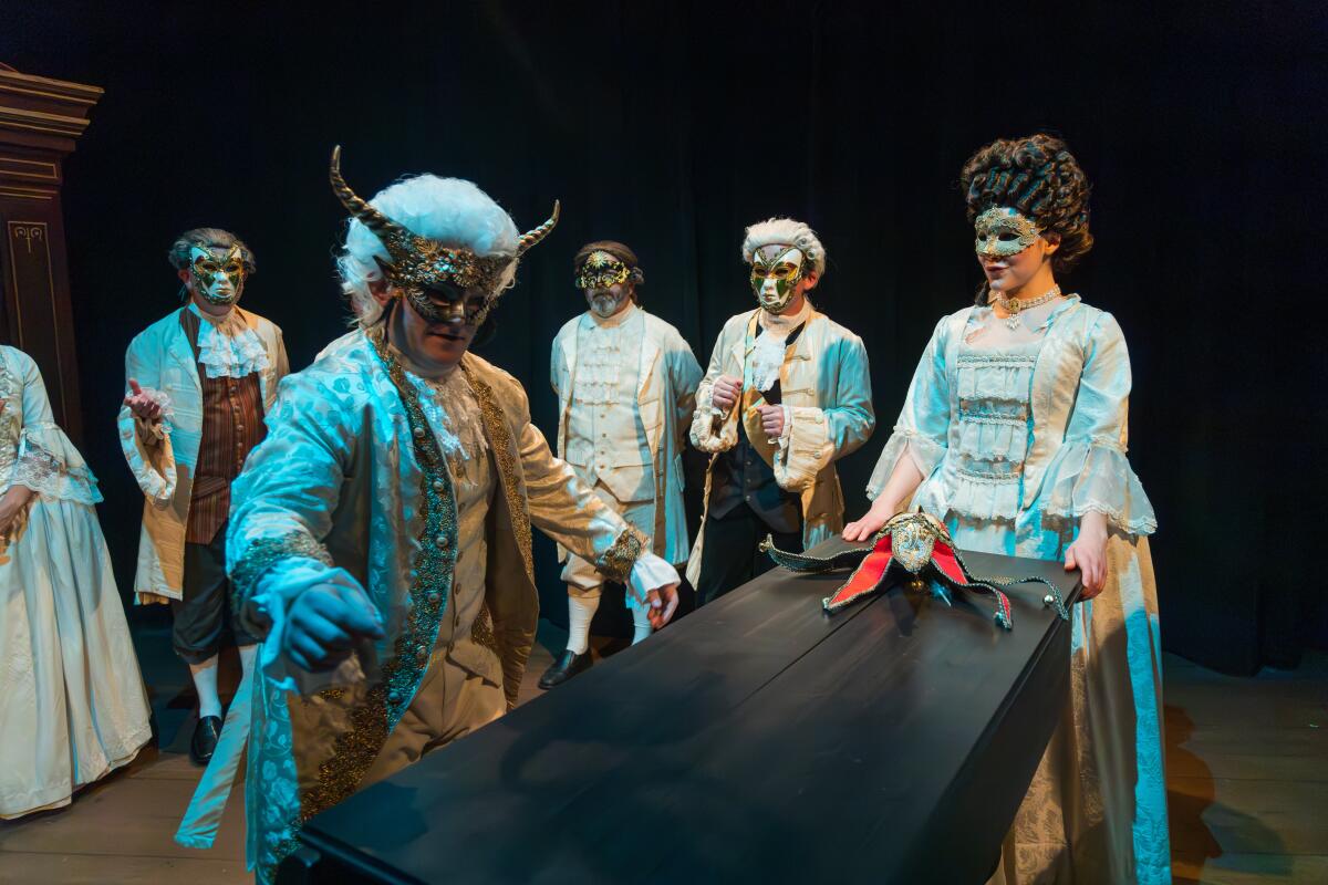 Actors perform in "Amadeus" dressed in period-inspired costumes and wigs.