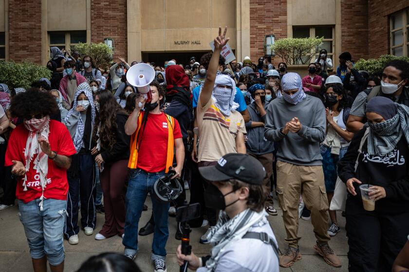 Los Angeles, CA - May 23: Pro-Palestinian protesters gather outside Murphy Hall at UCLA on Thursday, May 23, 2024 in Los Angeles, CA. (Jason Armond / Los Angeles Times)