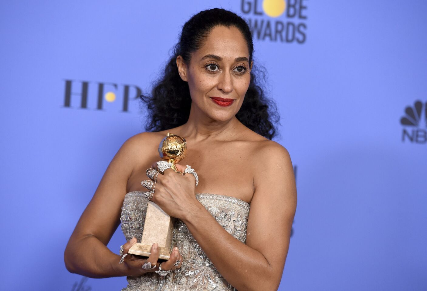 Tracee Ellis Ross with her award for lead actress in a TV musical or comedy for "black-ish."