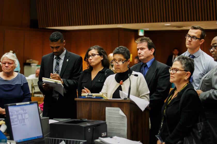 Social workers Stefanie Rodriguez, third from left, and Patricia Clement, far left, and supervisors Kevin Bom, second from right, and Gregory Merritt, fourth from right, appear for their arraignment.