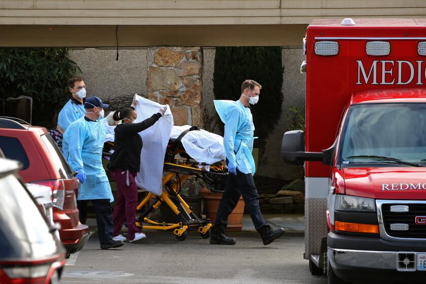 KIRKLAND, WA - MARCH 07: A patient is transferred into an ambulance at the Life Care Center on March 7, 2020 in Kirkland, Washington. As of today, 11 residents have died from COVID-19, since February 19th. Currently, there are 63 residents in the facility, slightly more than half of the 120 residents that were here before the first case was reported. (Photo by Karen Ducey/Getty Images)
