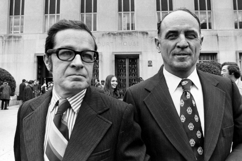 James W. McCord Jr., right, former security chief for President Richard Nixon's re-election committee, and his attorney Bernard Fensterwald, leave U.S. District Court in Washington, D.C., Friday, Nov. 9, 1973. Judge John J. Sirica imposed a sentence of 1 to 5 years on McCord for his role in the Watergate break-in. McCord will be allowed to remain free on bond for 15 days to put his affairs in order. (AP Photo)