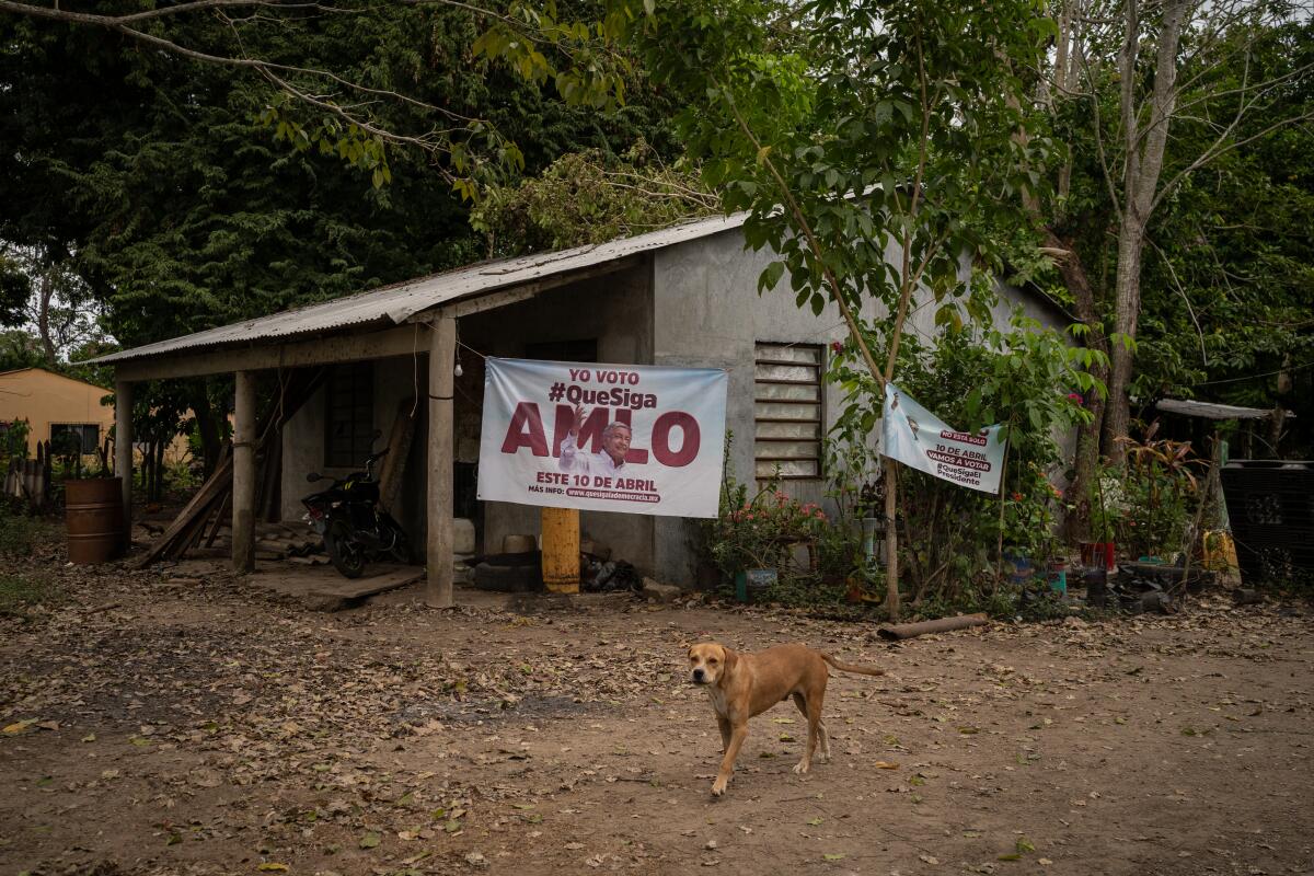 A large tarpaulin on the facade of their house in favor of the current president of Mexico.