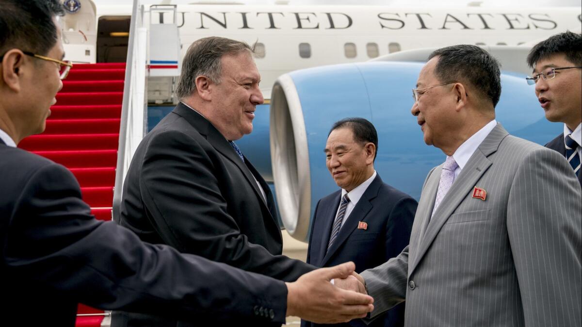 Secretary of State Michael R. Pompeo greets North Korean Foreign Minister Ri Yong Ho, second from right, as he arrives in Pyongyang on June 6. Another visit by Pompeo to North Korea has been canceled.