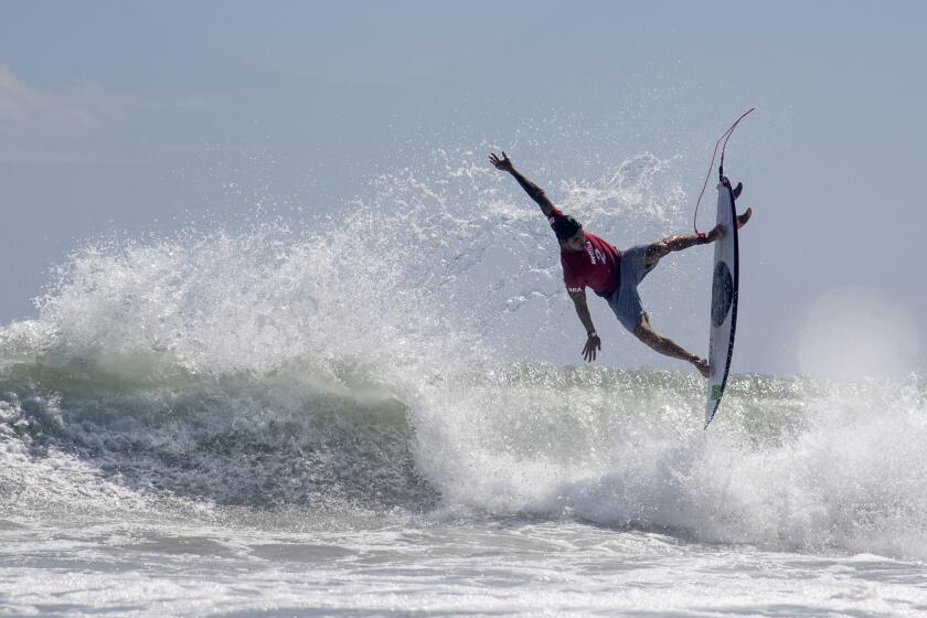 Brazil's Gabriel Medina rides a wave during the first round of the men's surfing competition.
