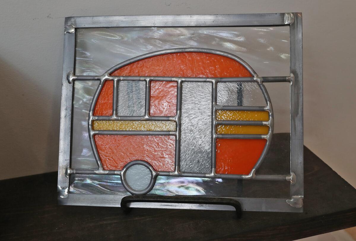 A vintage camper is one example of the work of stained-glass artist Barbara Bond.