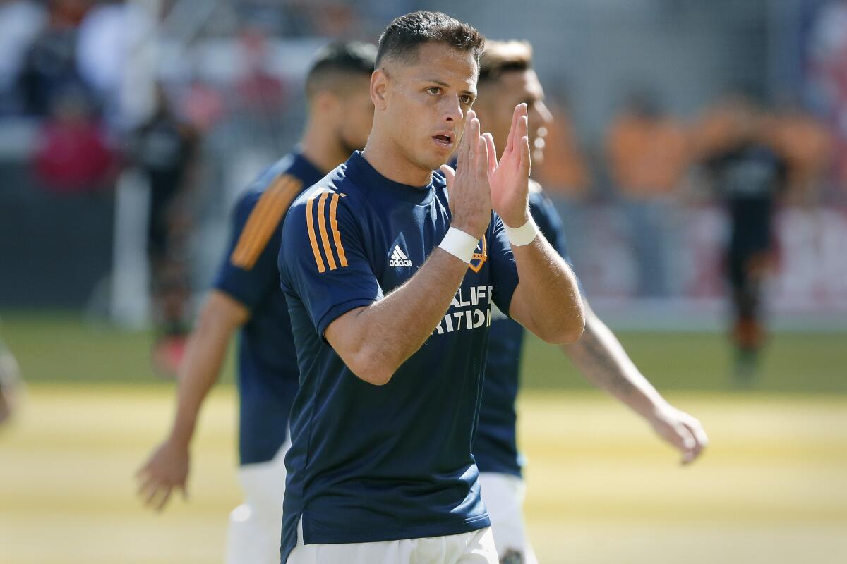 Galaxy forward Javier "Chicharito" Hernandez applauds fans during warmups.