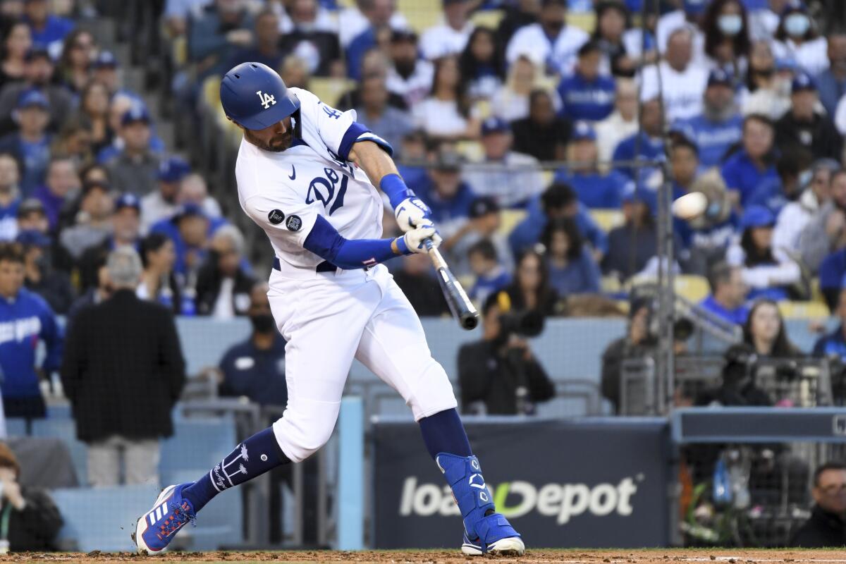 AJ Pollock hits a solo home run during the second inning for the Dodgers.