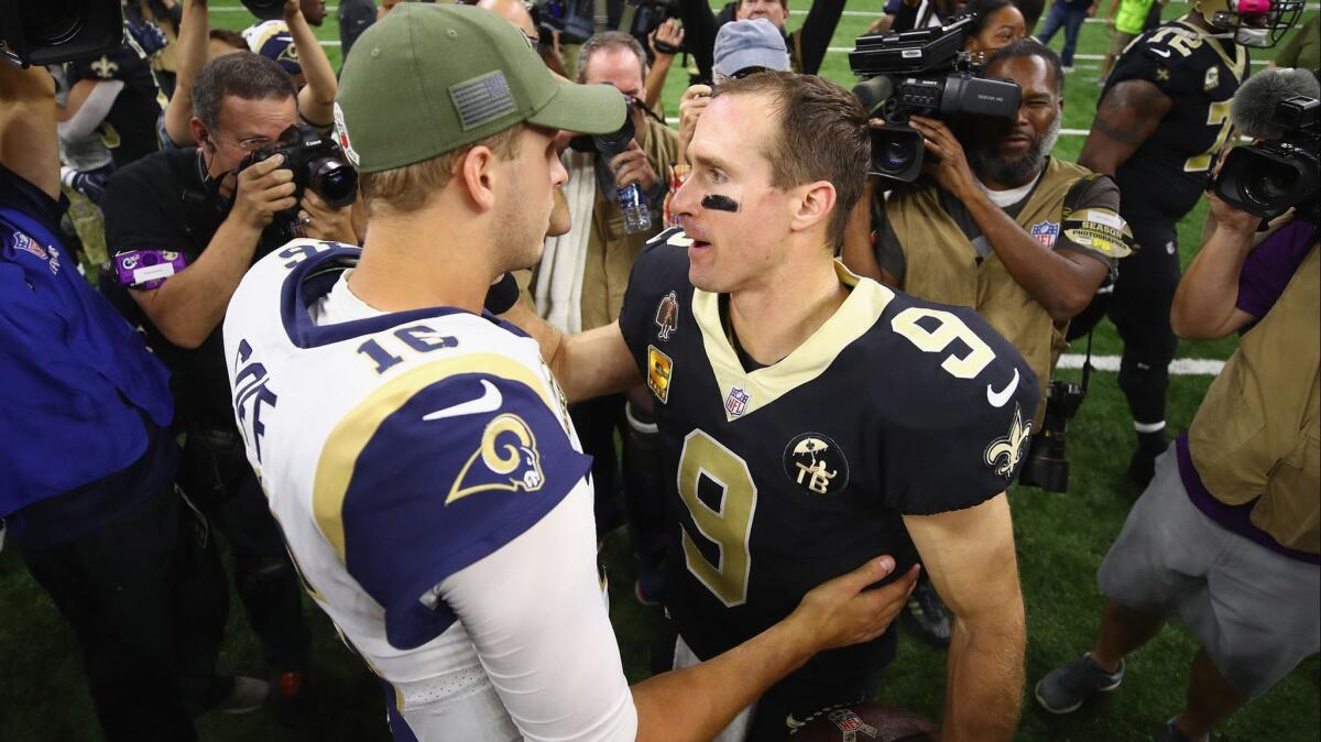 Rams quarterback Jared Goff, left, greets New Orleans Saints quarterback Drew Brees after the Saints defeated the Rams, 45-35, on Nov. 4, 2018 in New Orleans.