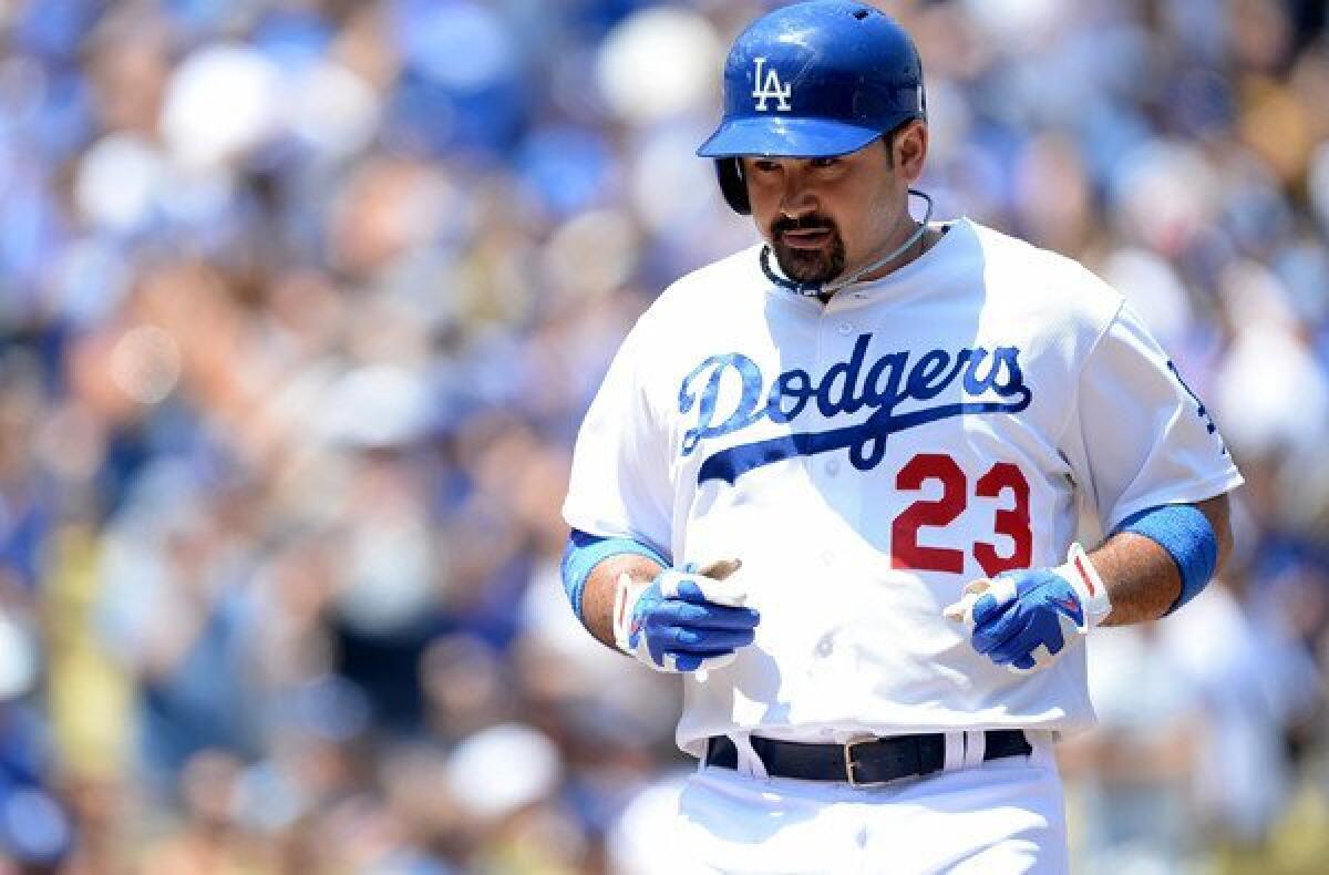 Dodgers first baseman Adrian Gonzalez trots home after hitting a two-run home run in the first inning against the Tampa Bay Rays on Saturday afternoon.