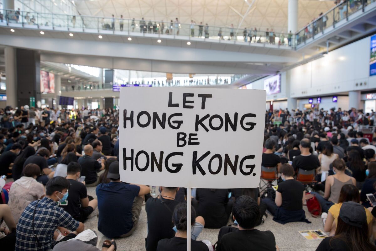 Protesters demonstrate inside the Hong Kong International Airport earlier this month.