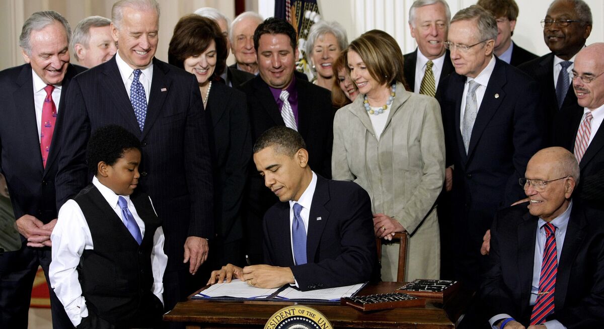 President Obama signs the Affordable Care Act into law in 2010. On Friday he vetoed Republican legislation that would have repealed it. The GOP does not have the votes to override his veto.