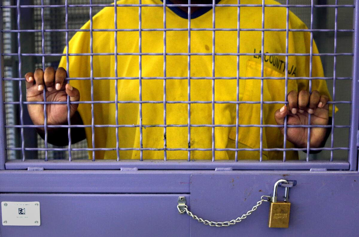 An inmate stands in his cell in the High Observation Mental Health unit of L.A. County's Twin Towers Correctional facility 