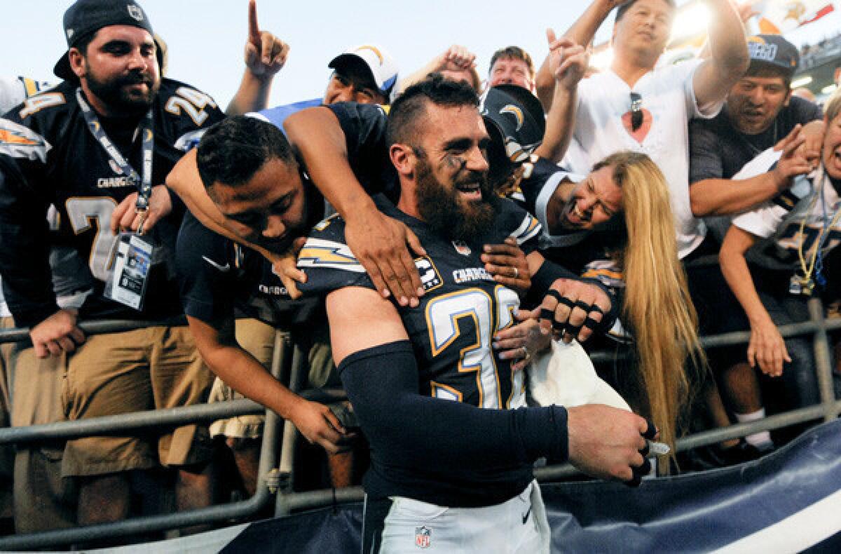 Chargers free safety Eric Weddle celebrates with fans after a victory over the Chiefs last month in San Diego.
