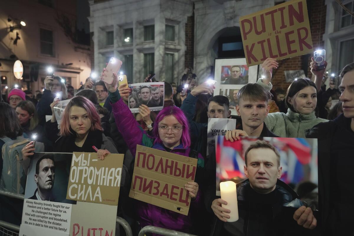 Protesters rally outside the Russian Embassy in London on Friday in response to the news of Alexei Navalny's death in prison.