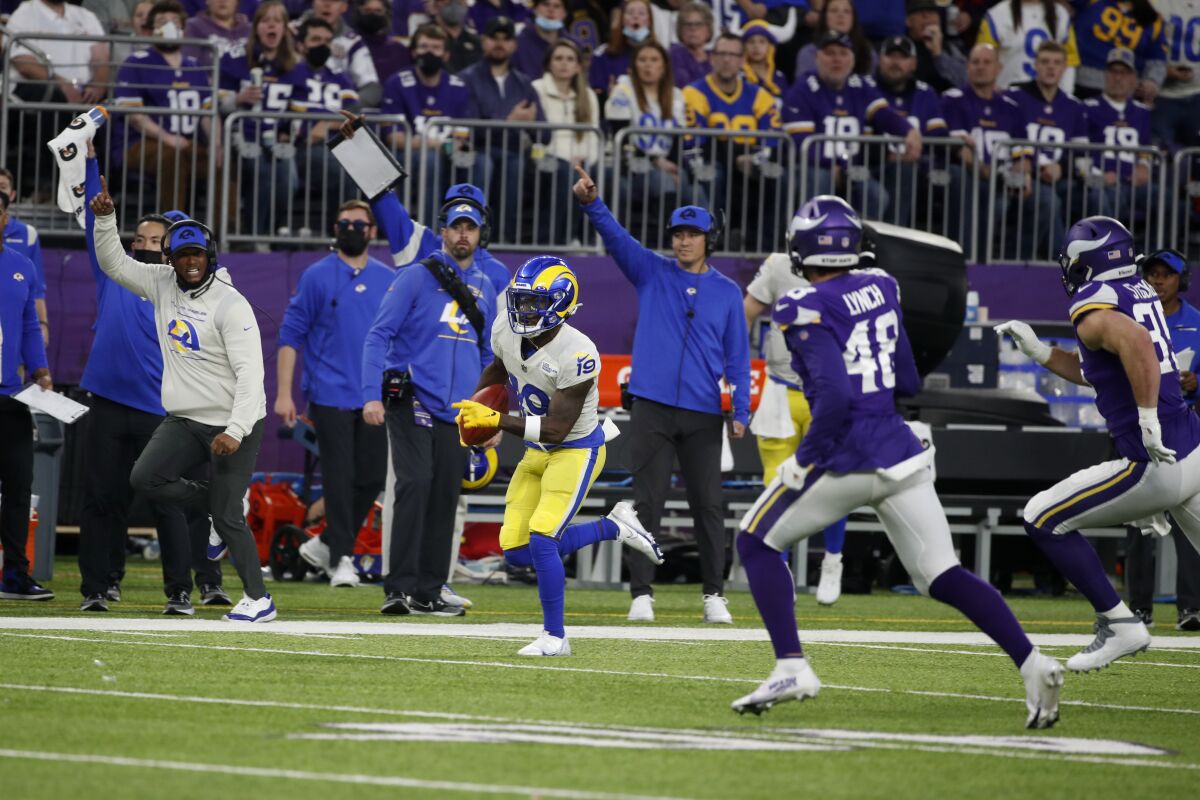 Rams' Brandon Powell (19) returns a punt 61 yards for a touchdown against the Minnesota Vikings.