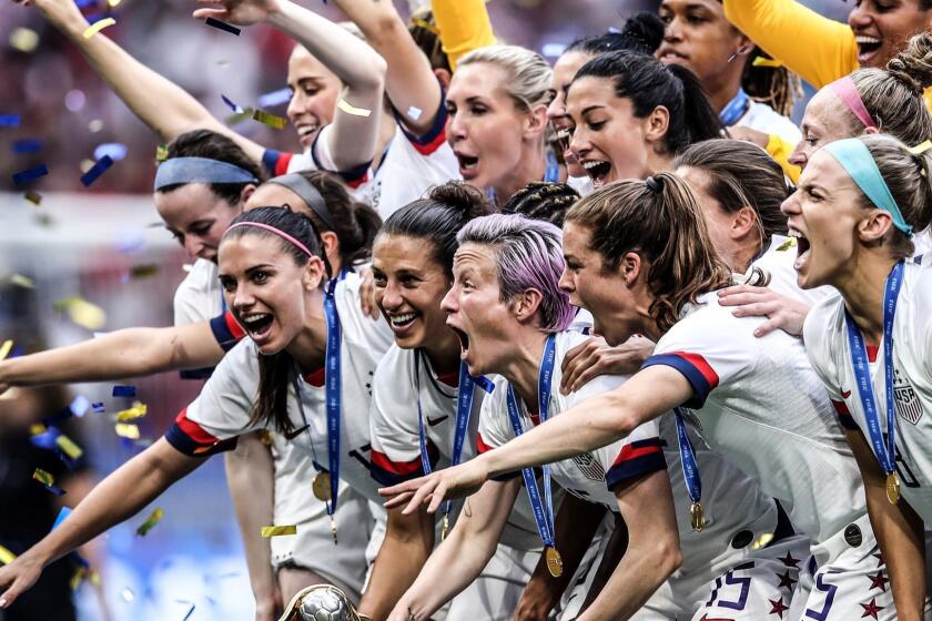LYON, FRANCE - JULY 07: (EDITORS NOTE: Image has been digitally enhanced.) Megan Rapinoe of the USA lifts the FIFA Women's World Cup Trophy following her team's victory in the 2019 FIFA Women's World Cup France Final match between The United States of America and The Netherlands at Stade de Lyon on July 07, 2019 in Lyon, France. (Photo by Alex Grimm/Getty Images) *** BESTPIX *** ** OUTS - ELSENT, FPG, CM - OUTS * NM, PH, VA if sourced by CT, LA or MoD **