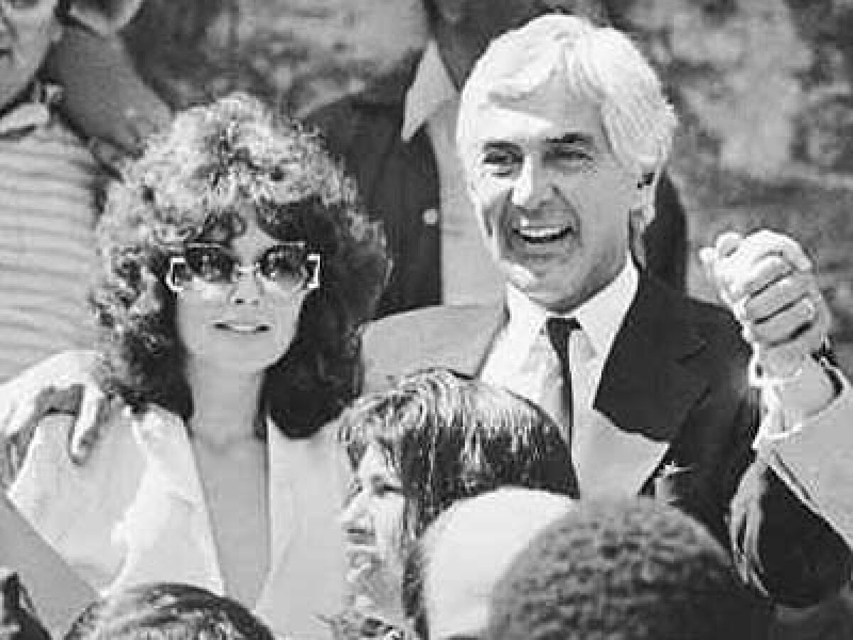 John DeLorean and his wife, Cristina Ferrare, leave court in 1984 after he was acquitted of drug charges.