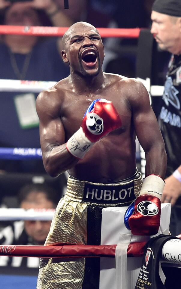 Floyd Mayweather Jr. celebrates after beating Manny Pacquiao by unanimous decision.