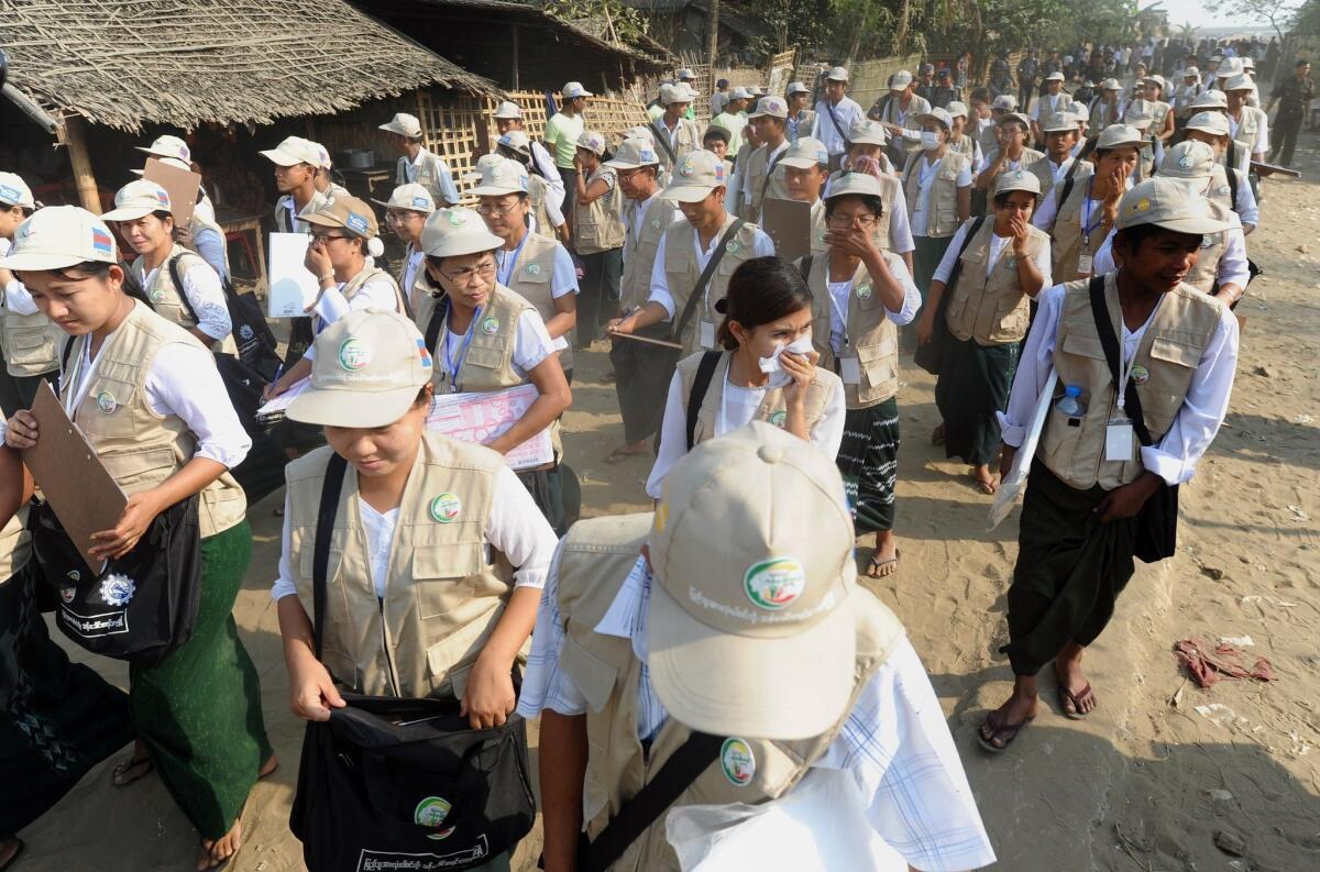 Census workers in the village of Barasa in the western Myanmar state of Rakhine. Tens of thousands of census-takers fanned out across the nation to gather data.