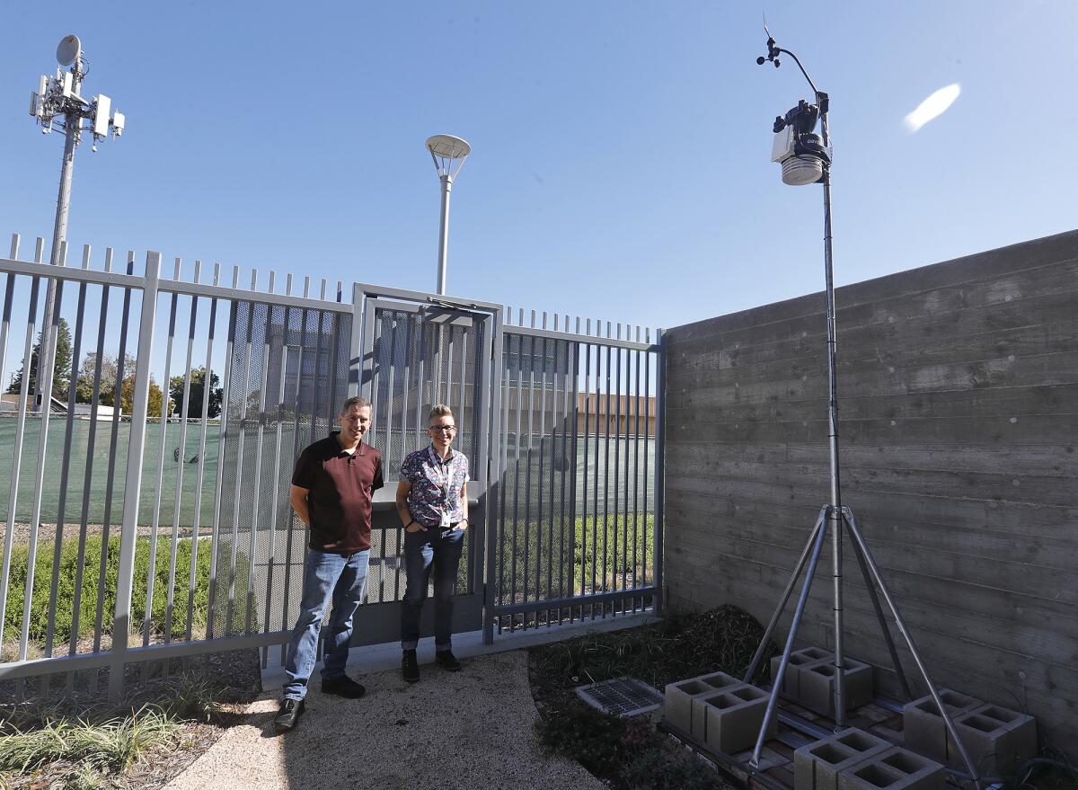 OCC's Chris Quinn and Jaime Speed plan to use a newly installed weather station in their geography classes next semester.