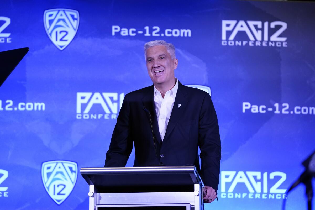 Pac-12 commissioner George Kliavkoff speaks at a lectern