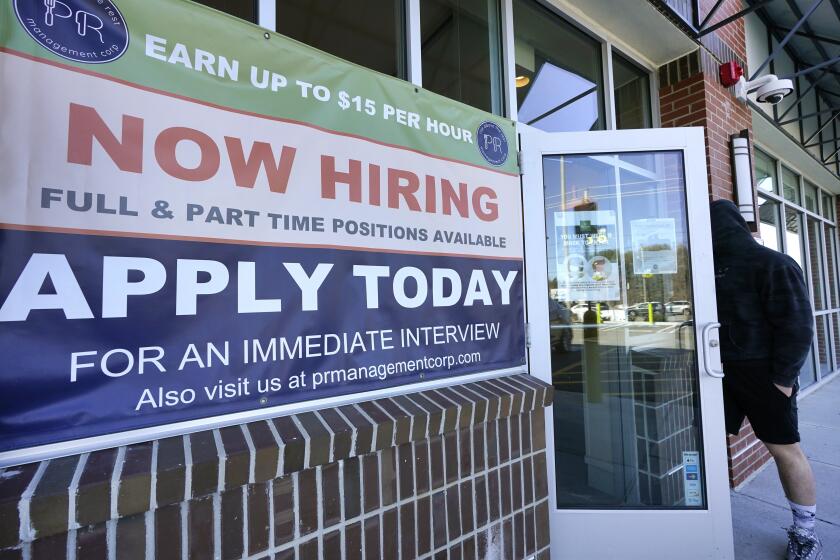 A man walks into a restaurant displaying a "Now Hiring" sign, Thursday, March 4, 2021, in Salem, N.H. U.S. employers added a robust 379,000 jobs last month, the most since October and a sign that the economy is strengthening as confirmed viral cases drop, consumers spend more and states and cities ease business restrictions. (AP Photo/Elise Amendola)