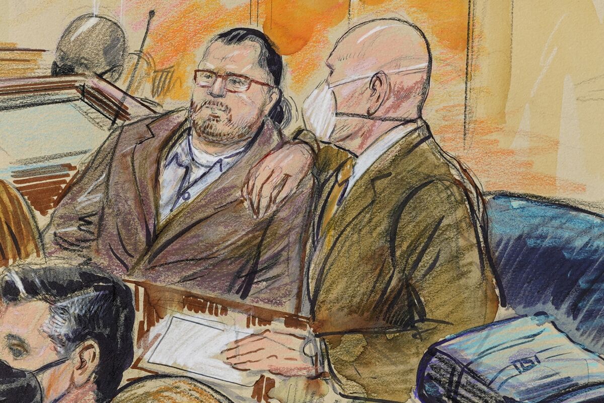 This artist sketch depicts Guy Wesley Reffitt, joined by his lawyer William Welch, right, in Federal Court, in Washington, Monday, Feb. 28, 2022. Reffitt, a Texas man charged with storming the U.S. Capitol with a holstered handgun on his waist, is the first Jan. 6 defendant to go on trial. (Dana Verkouteren/San Francisco Chronicle via AP)