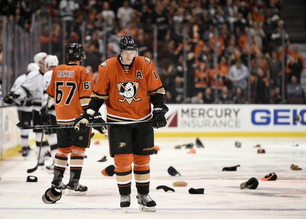 Ducks right wing Corey Perry (10) looks on as hats are thrown onto the ice after he scored his third goal against the Kings.