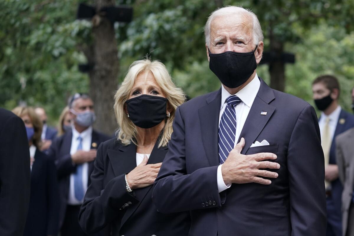 Joe and Jill Biden with hands over their hearts at a New York ceremony marking 19 years since the 9/11 terrorist attacks. 