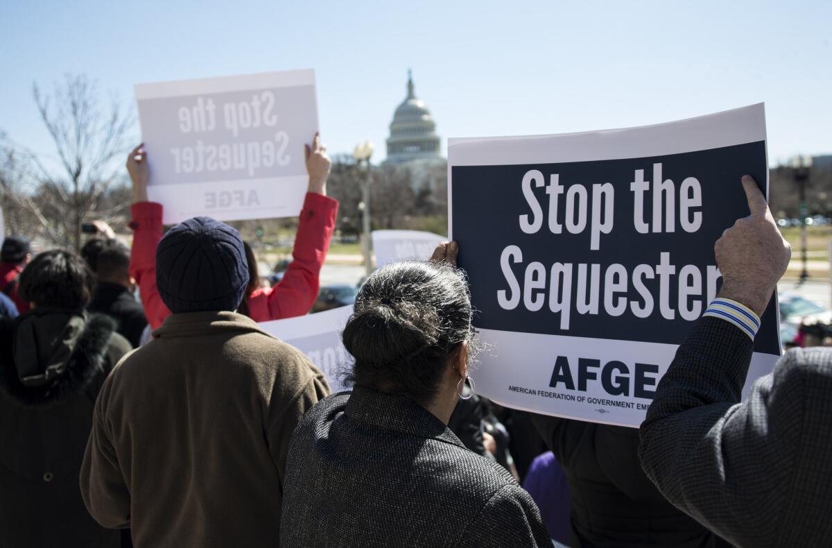 Members of the American Federation of Government Employees gather during a rally outside the Department of Labor in Washington, D.C. Some Republican lawmakers are also complaining about the sequester.