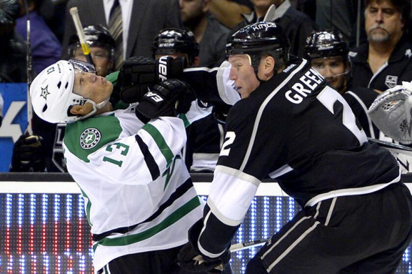 Kings defenseman Matt Greene sends Stars left wing Ray Whitney reeling during the third period of a game last month at Staples Center.
