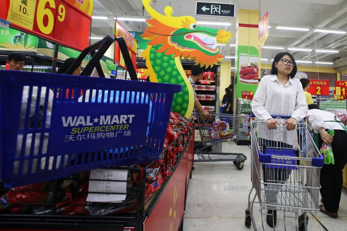 A Chinese consumer shops in a Wal-Mart super-center in Qingdao, in eastern China's Shandong province.