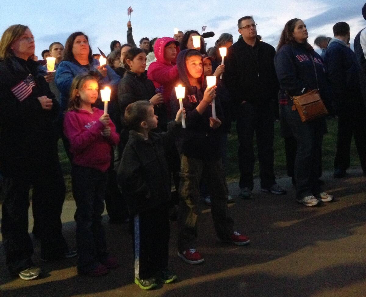 Residents of the Dorchester neighborhood at a candlelight vigil for 8-year-old Martin Richard, who died in the marathon bombing.