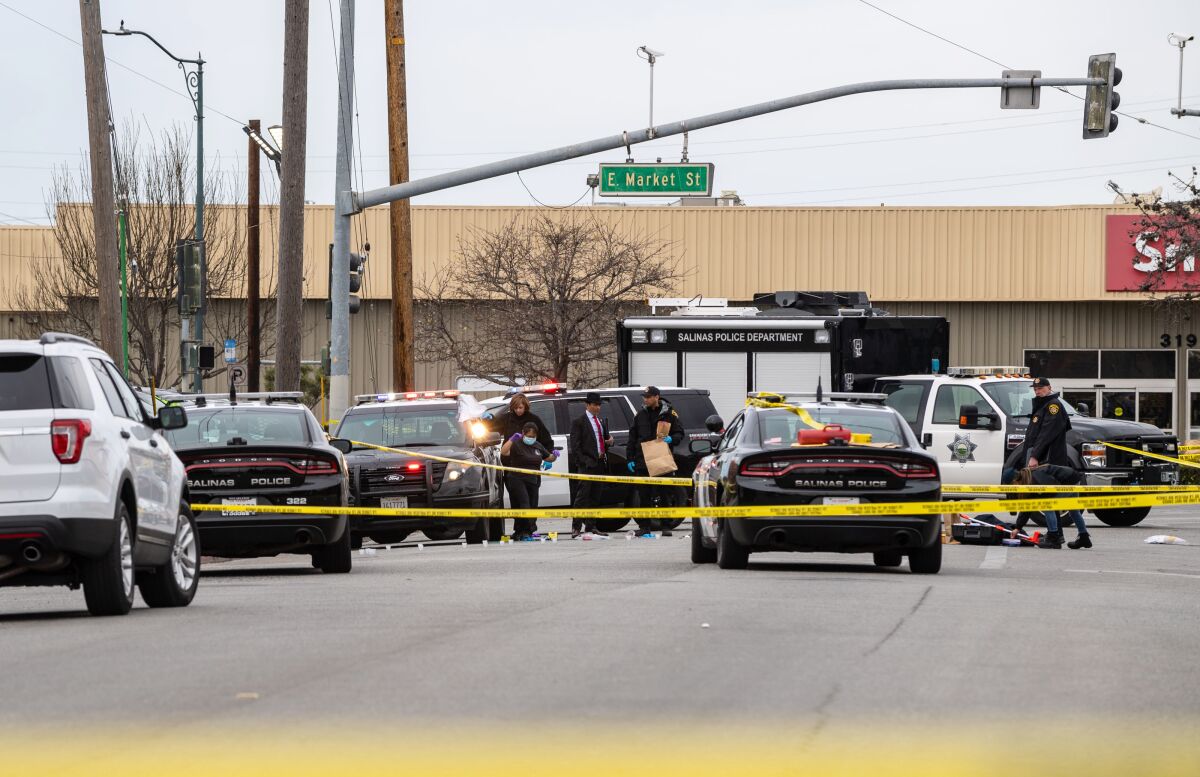 Law enforcement investigates at the scene of a fatal shooting in Salinas on Saturday.
