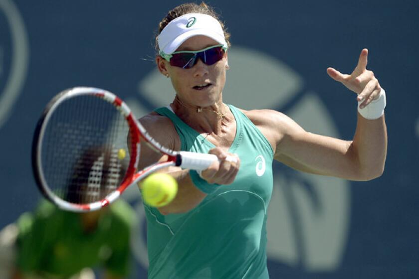 Samantha Stosur of Australia returns a shot against Victoria Azarenka of Belarus during the final of the Southern California Open on Sunday in Carlsbad.