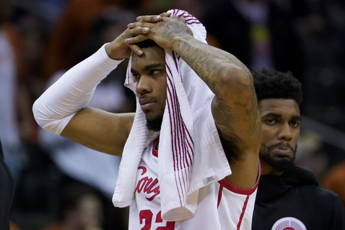 Houston forward Reggie Chaney leaves the court after their loss against Miami in a Sweet 16 college basketball game in the Midwest Regional of the NCAA Tournament Friday, March 24, 2023, in Kansas City, Mo. (AP Photo/Jeff Roberson)
