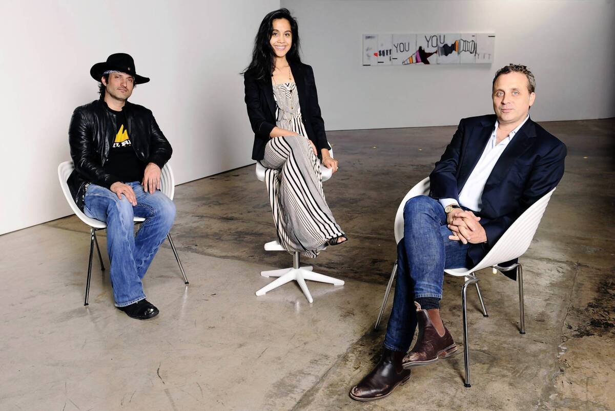 Director Robert Rodriguez, left, is joined by FactoryMade Ventures founders Cristina Patwa and John Fogelman. Rodriguez is chairman and CEO of the company's El Rey Network, which debuts in December.