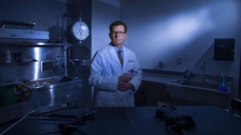 Dr. Jonathan Lucas, Los Angeles' new chief medical examiner-coroner, is seen in a San Diego autopsy exam room in 2014.