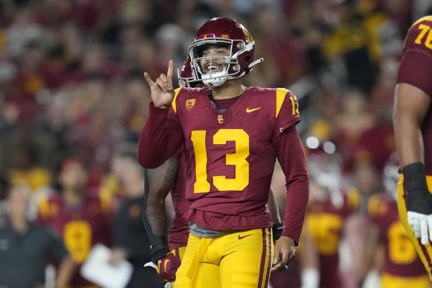 Southern California quarterback Caleb Williams (13) signals to a teammate during the first half of an NCAA college football game against Stanford in Los Angeles, Saturday, Sept. 9, 2023. (AP Photo/Ashley Landis)