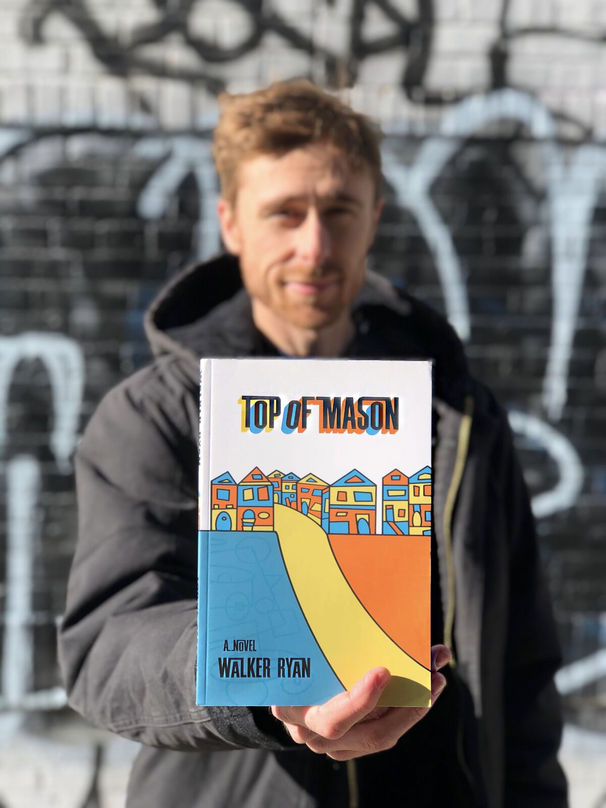 Walker Ryan with his first novel, "Top of Mason."