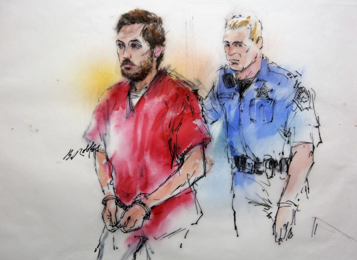 A courtroom sketch shows James Holmes being escorted to a preliminary hearing in Centennial, Colo., in January 2013.